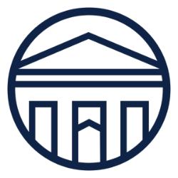 -Dark blue circular emblem featuring a stylized building with a triangular roof and three columns. The central column includes a chevron detail pointing upward. The clean lines and symmetry give it a formal, institutional appearance. The design suggests an academic or university logo.