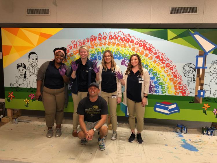 Artist Monty Montgomery and others at Virginia Children’s Book Festival mural