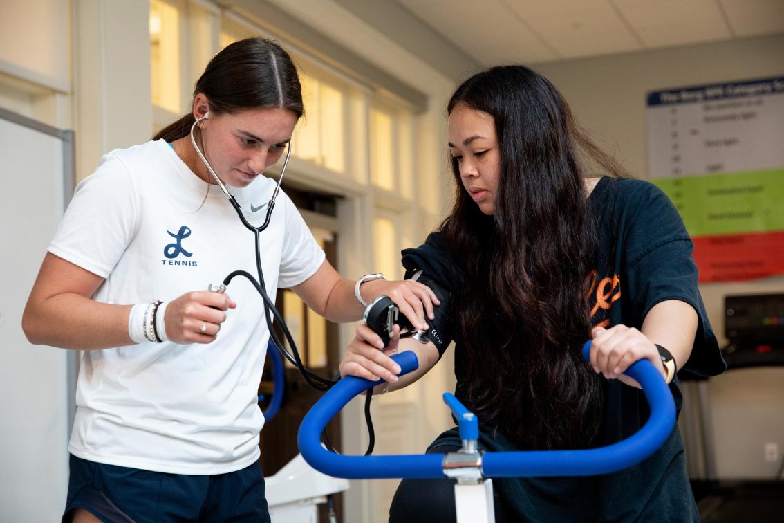 Longwood kinesiology students practice blood pressure assessment in a lab