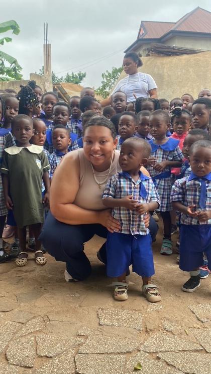 A student poses with a boy in Africa.