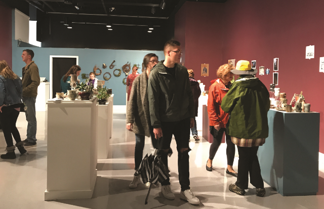 Shoppers browse the student artwork on sale at the Longwood Center for the Visual Arts. (Photo courtesy of Rachel Ivers)