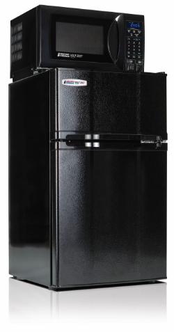 MicroFridge closed - A compact black refrigerator stands with a microwave placed on top. The microwave features a digital keypad and display on the right side. Both appliances are part of a stacked MicroFridge-style unit. The unit is shown against a plain light background.