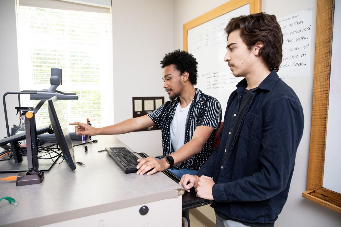 Two students working together on a project