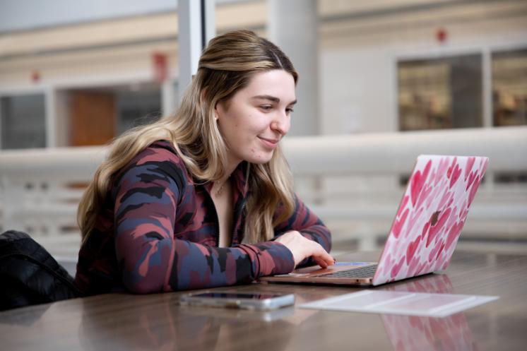 Student studying with a laptop