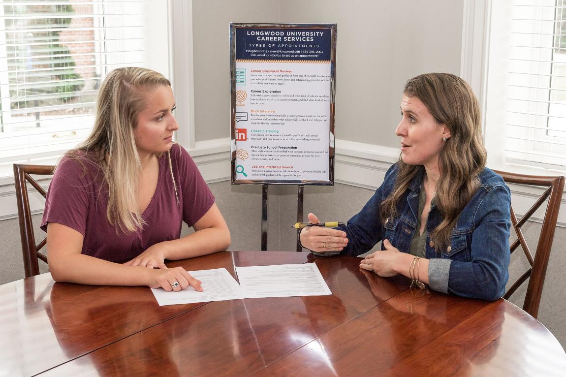 Kyle Hodges (right), assistant director of campus career engagement, is happy to go over all the options available to students for internships or networking for their first job after graduation. 