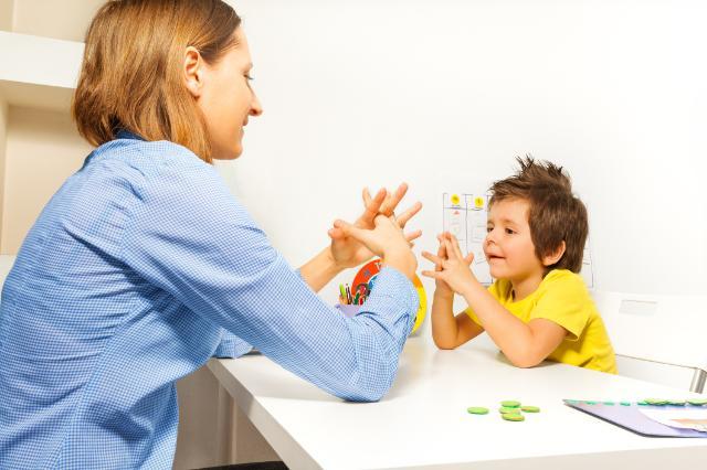 Teacher working with a child