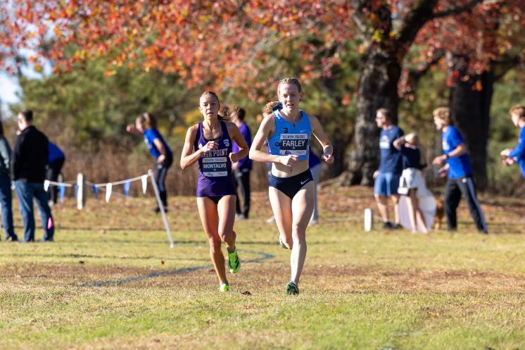 Born with a brain condition known as PMG, Sophie Farley ’28 (right) has thrived as a member of Longwood’s cross country and track program and found herself in the process. (Photo credit: Big South Conference)