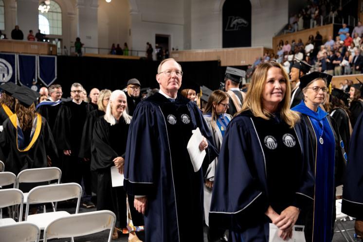 Longwood's vice rector, David Rose (middle), walks in the recessional at Convocation 2026