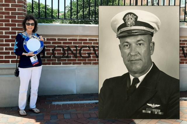 Liz Cole (left) in front of the Longwood sign with a photo of her father on the right.