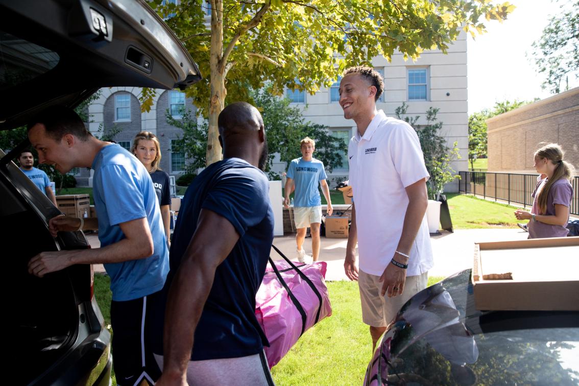 Men's Head Basketball Coach Ronnie Thomas was among the volunteers helping new Lancers and their families unload during move-in.