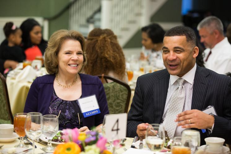 During the 2016 Alumni Awards ceremony, O'Kelly McWilliams '90 (right) sat next to Kris Harbour '80, whom he credits with mentoring him during his time as a student.