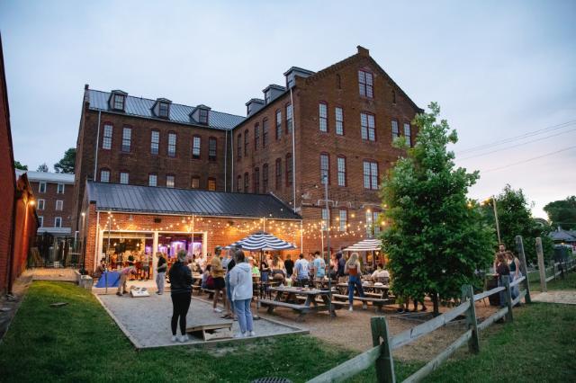 Students and friends hanging out at Three Roads Brewing during Senior Week